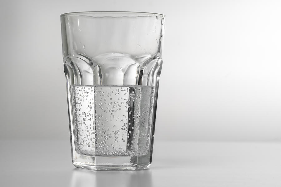 A glass of carbonated mineral water Photograph by A. Aleksandravicius