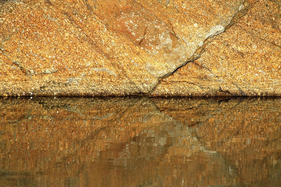 A golden-brown rock is reflected in glassy water Photograph by Ulrich Kunst And Bettina Scheidulin