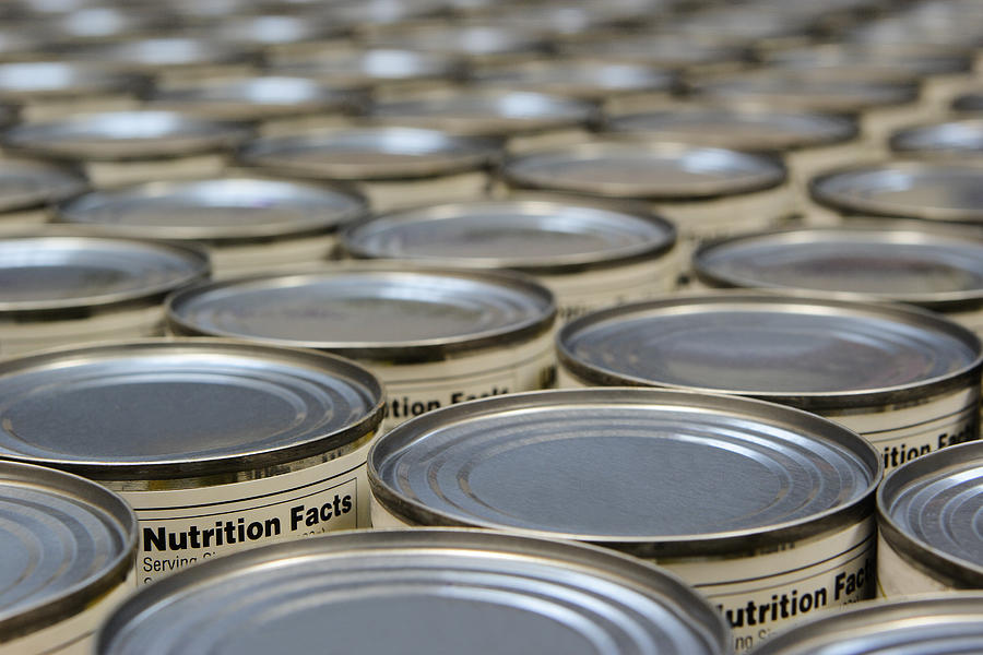 A group of food cans with the nutrition fact label showing Photograph by ChuckSchugPhotography