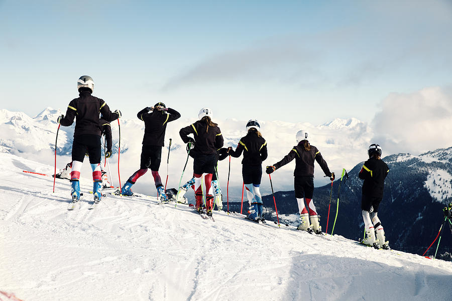A group of teenagers at ski school race training in Verbier, Switzerland Photograph by Luca Sage