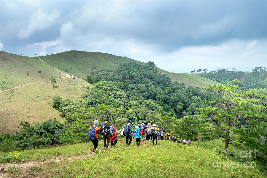 a group of travelers take the trekking trails along Ta Nang-Phan Dung ...