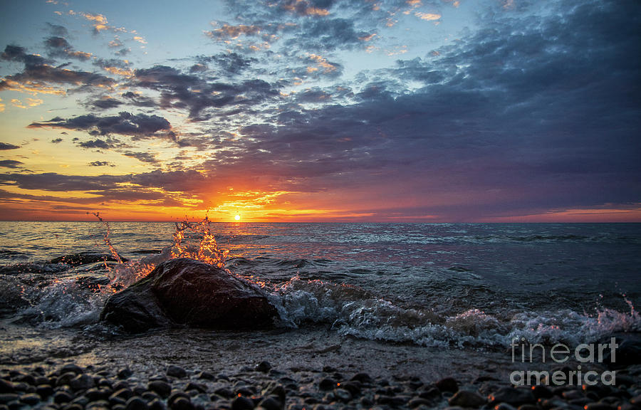 A heart shaped splash at sunrise Photograph by Eric Curtin