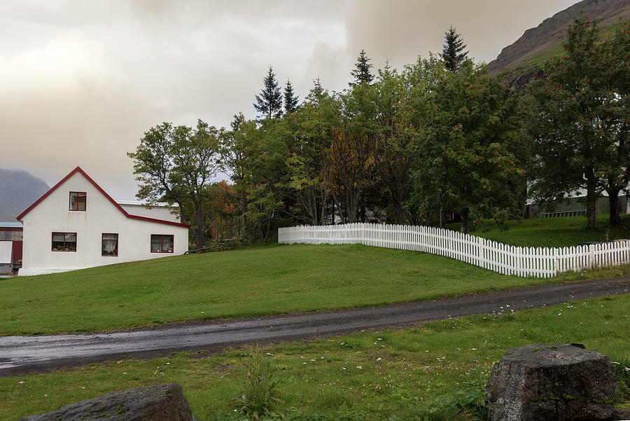 White house and fence in Seydisfjordur, Iceland Photograph by RicardMN Photography