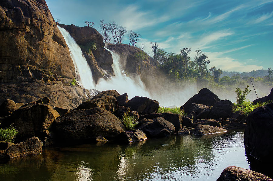 A landscape view of a waterfall named Athirapally Photograph by Arpan Bhatia