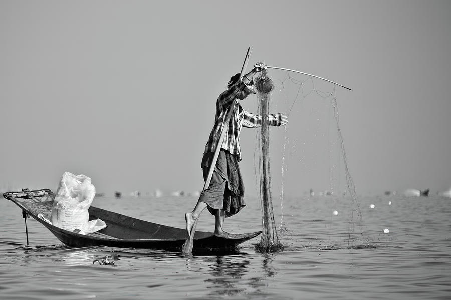 A leg-rowing fisherman, Inle Lake Photograph by Lie Yim