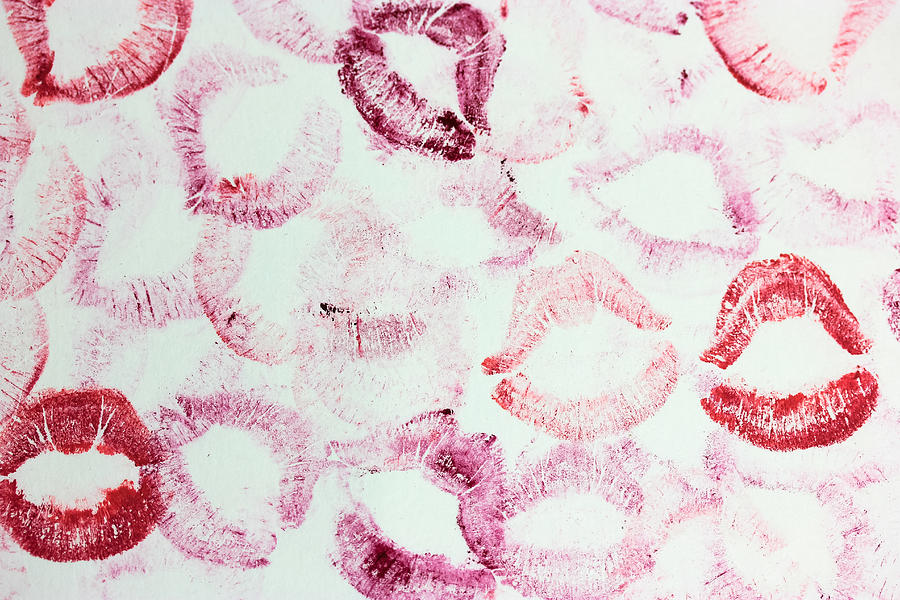 A lip print left by lipstick on white paper. Kiss lipstick patterns and ...