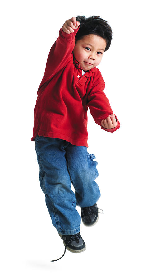 A Little Asian Boy In A Red Shirt  Jumps Up And Throws His Arms Forward Photograph by Photodisc