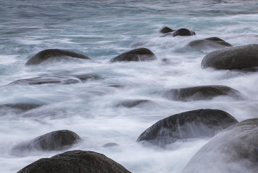 A long exposure of sea water rolling over rocks Photograph by Jordanwhipps1987