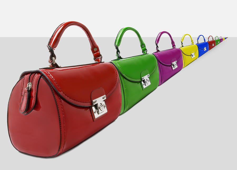 A long line of different coloured handbags. Photograph by Richard Boll
