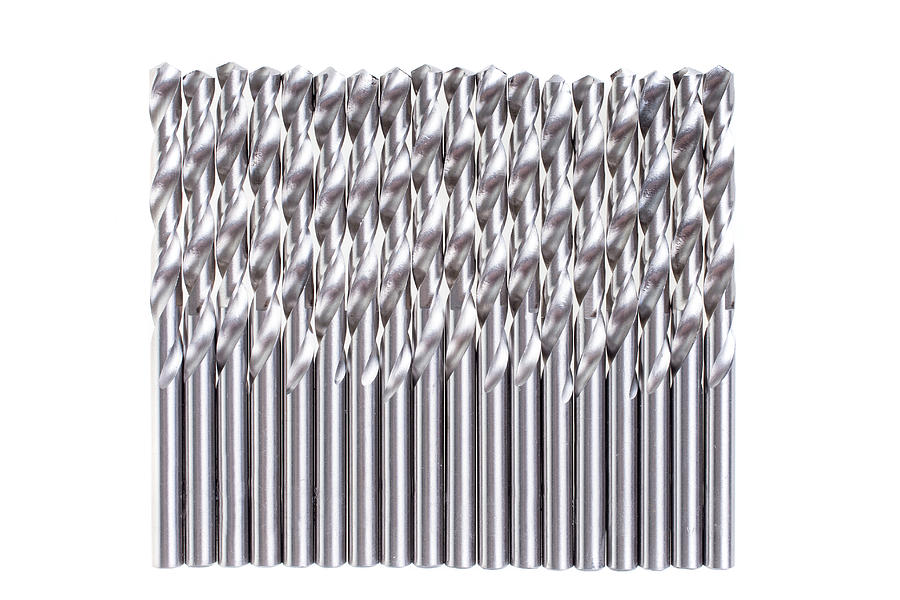 A Lot Of Spiral Drill Bits On White Background Photograph