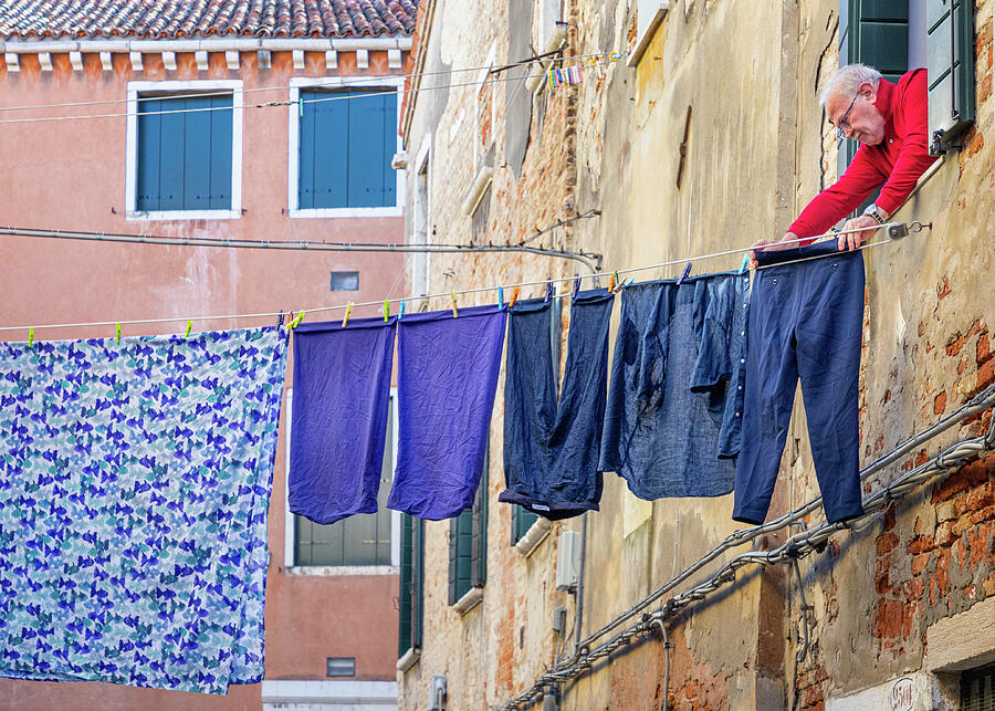 A Man And His Blue Laundry Photograph by Elvira Peretsman