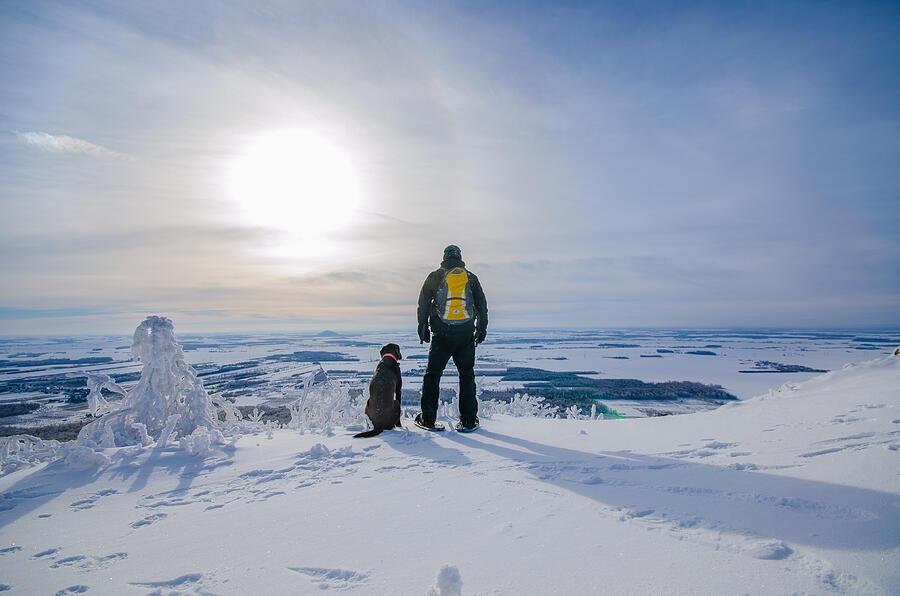 A man and his dog admiring the winter landscape Photograph by Noémi Laganière Gosselin