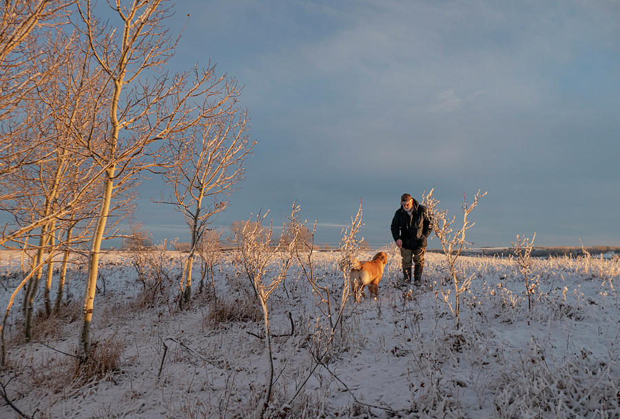 Winter Photograph - A man and his dog by Phil And Karen Rispin