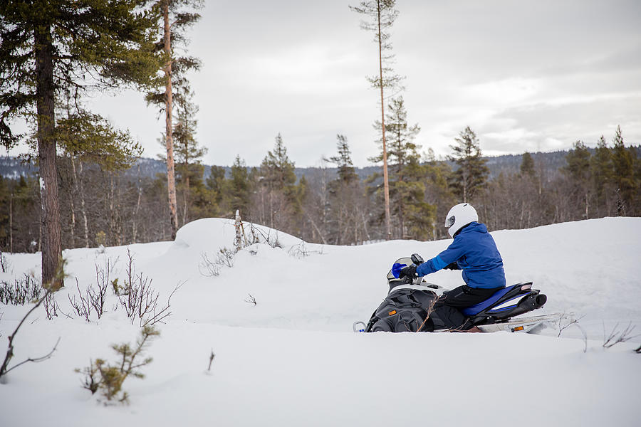 A Man Drives a Snowmobile on a Mountain in Rural Norway, Wintertime Photograph by Morten Falch Sortland