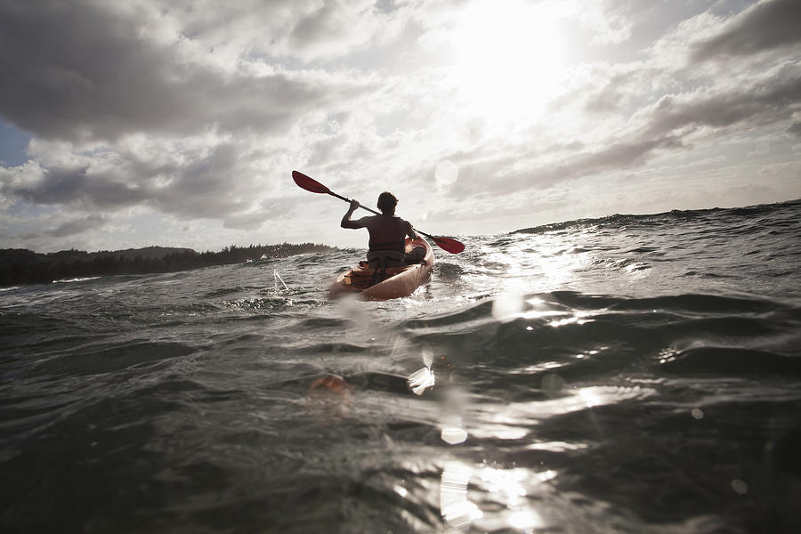 A man kayaks in the ocean Photograph by Noel Hendrickson