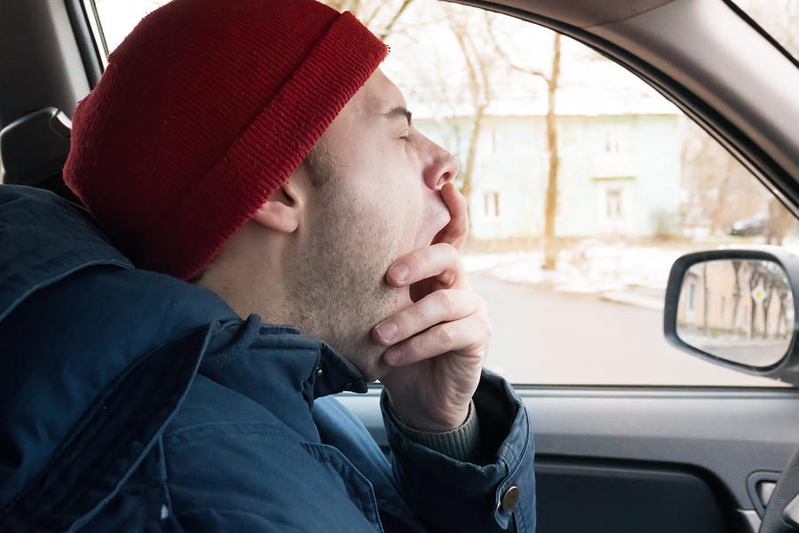 A Man Rides On The Road In Winter, A Man Yawns At The Wheel, Tired Of Driving Photograph by Evgeniy Anikeev A Man Rides On The Road In Winter, A Man Yawns At The Wheel, Tired Of Driving Photograph by Evgeniy Anikeev