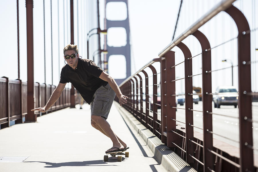 A man skateboarding on the Golden Gate. Photograph by Jordan Siemens
