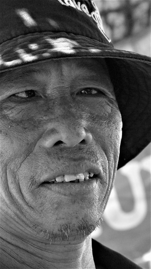 Man with squint eyes Photograph by Robert Bociaga