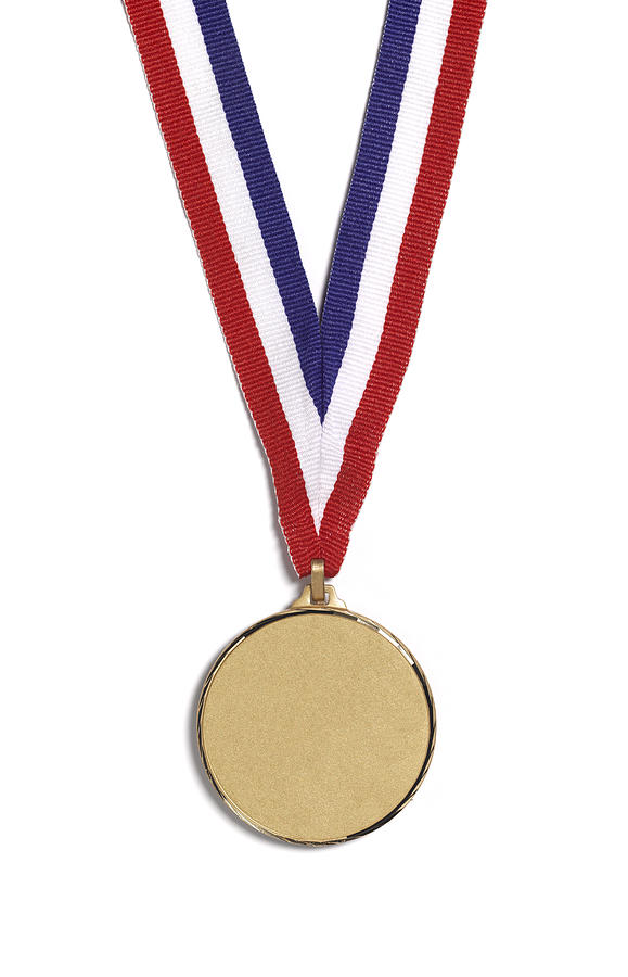 A medal on a striped ribbon, on a white background Photograph by Peter Dazeley