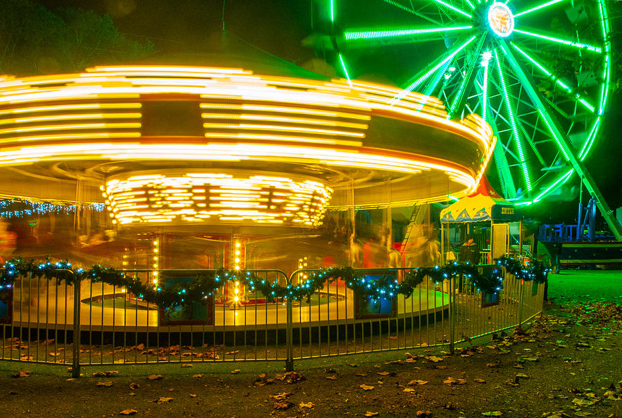 A Merry-Go-Round and Ferris Wheel at the Largo Holiday Lights Photograph by L Bosco
