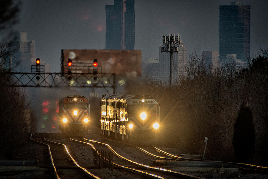 A Metra Express train passes another Metra local Chicago Illinois Photograph by Jim Pearson