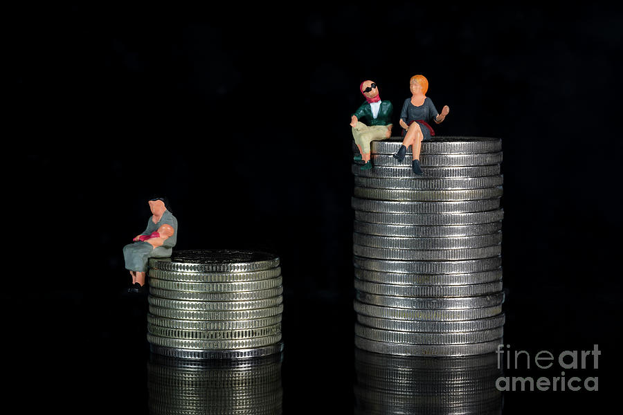 A miniature woman holding a baby on a pile of coins and two miniature women sitting on a pile of coins. The concept of the relationship between child care and womens payroll. Macro Photograph by Pablo Avanzini