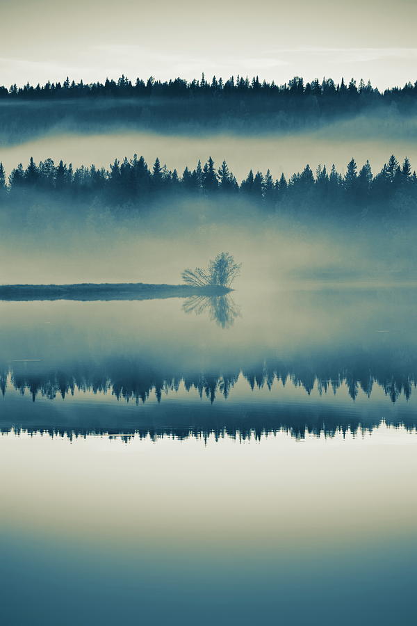 A misty forest is reflected in a glassy lake - duotone Photograph by Ulrich Kunst And Bettina Scheidulin