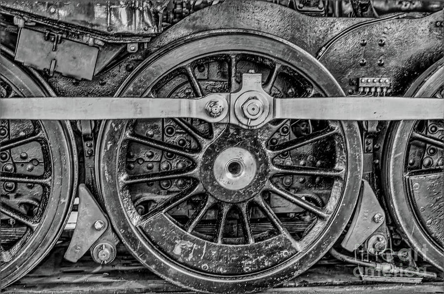 A monochrome picture of steam train wheels taken in the York railway museum, Yorkshire UK 2019 Photograph by Pics By Tony