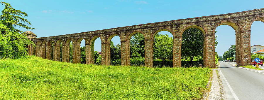 A panorama view of the Nottolini aqueduct in Lucca Italy Photograph by