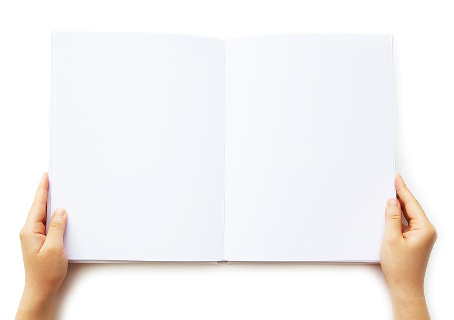 A person holding a blank book of paper  Photograph by BingoPixel