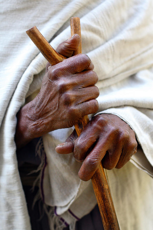 A person holding a walking stick in Lake Tana, Ethiopia. Photograph by Dietmar Temps