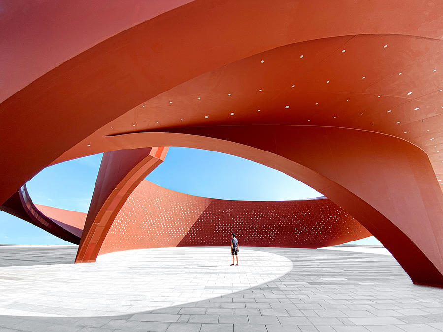 A person in a red curved abstract architectural space, 3D rendering Photograph by Xiaoke Chen