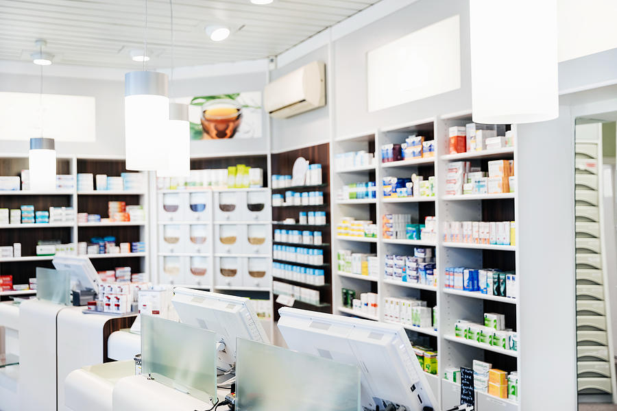A Pharmacy Counter With Medicine On Display Photograph by Tom Werner