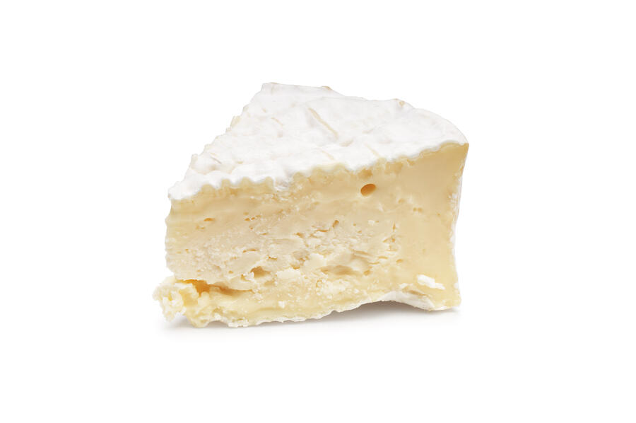 A piece of Camembert on a white background Photograph by JohnGollop