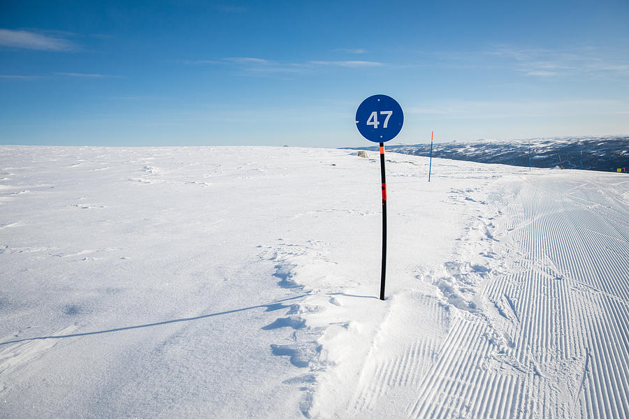 A Piste Marker on a Ski Slope in Southern Norway, Wintertime Photograph by Morten Falch Sortland