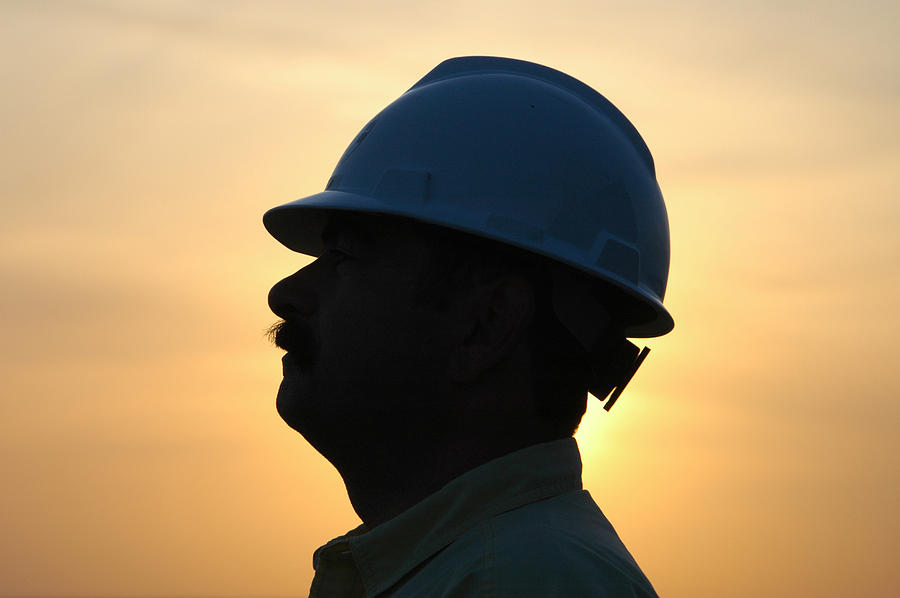 A profile of a construction worker in silhouette Photograph by HHakim