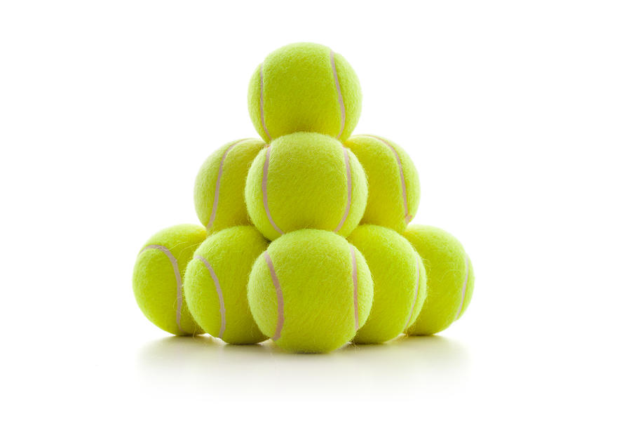 A pyramid of tennis balls Photograph by Emrah Turudu