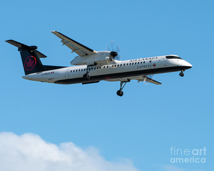 Airplane Photograph - A Q400 on Final to YVR by Joe Kunzler