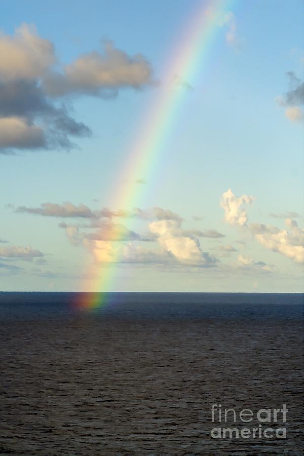 A rainbow appears over the Caribbean near the island of Saint Martin, West Indies, Caribbean Sea Photograph by William Kuta