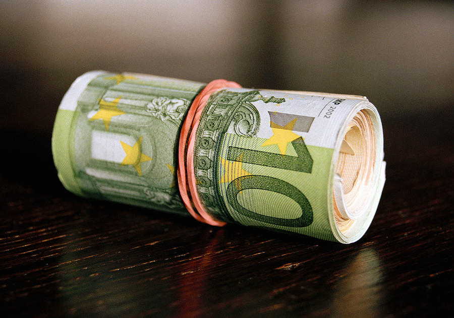 A roll of Euro banknotes Photograph by Martin Diebel