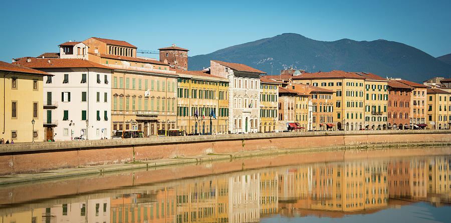 A row of historic buildings along the river Arno in Pisa Italy lungarno by Ambrosini V