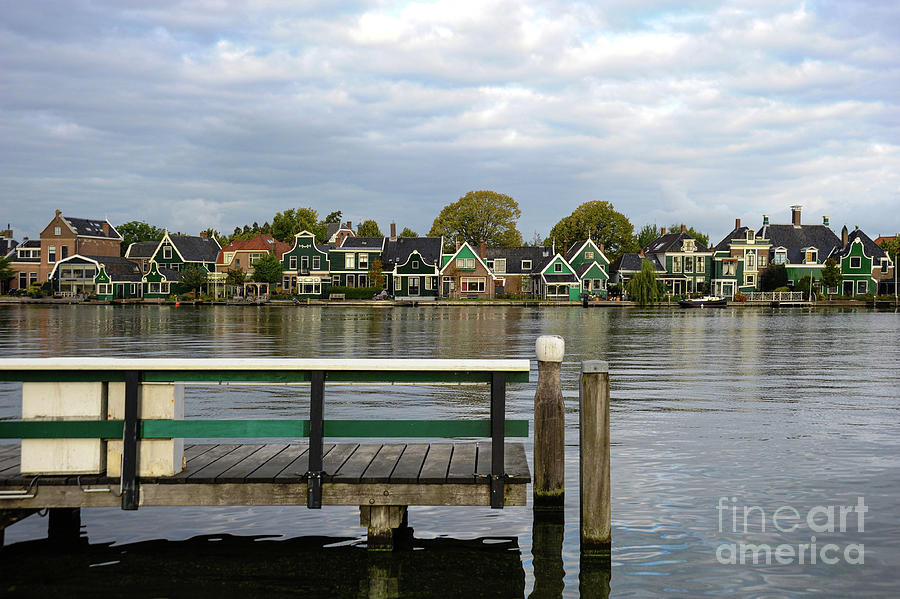 A row of old world Dutch architecture homes line the canal.   Photograph by Gunther Allen