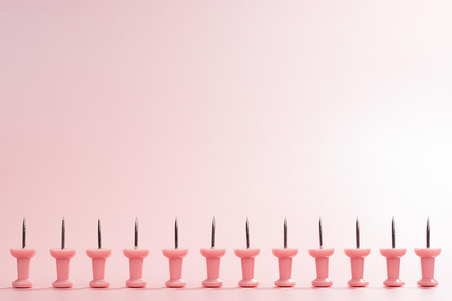 A Row of Pink Thumbtack Photograph by MirageC
