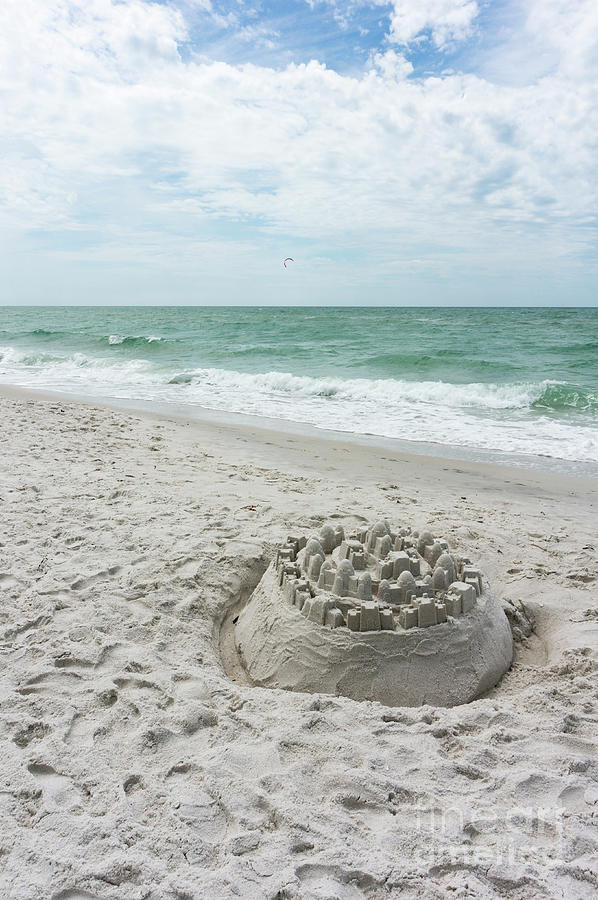 A sandcastle  lies on a beach in Naples, Florida Photograph by William Kuta