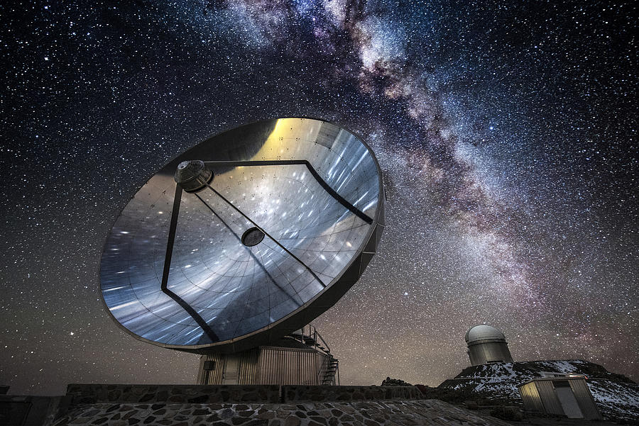 A satellite and telescope under the Milky Way. Photograph by Alberto Ghizzi Panizza