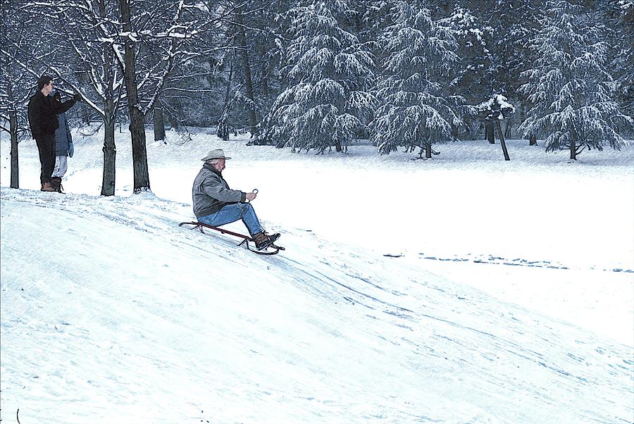 A senior man sleds down a steep hill in Rockville Maryland USA Photograph by William Kuta