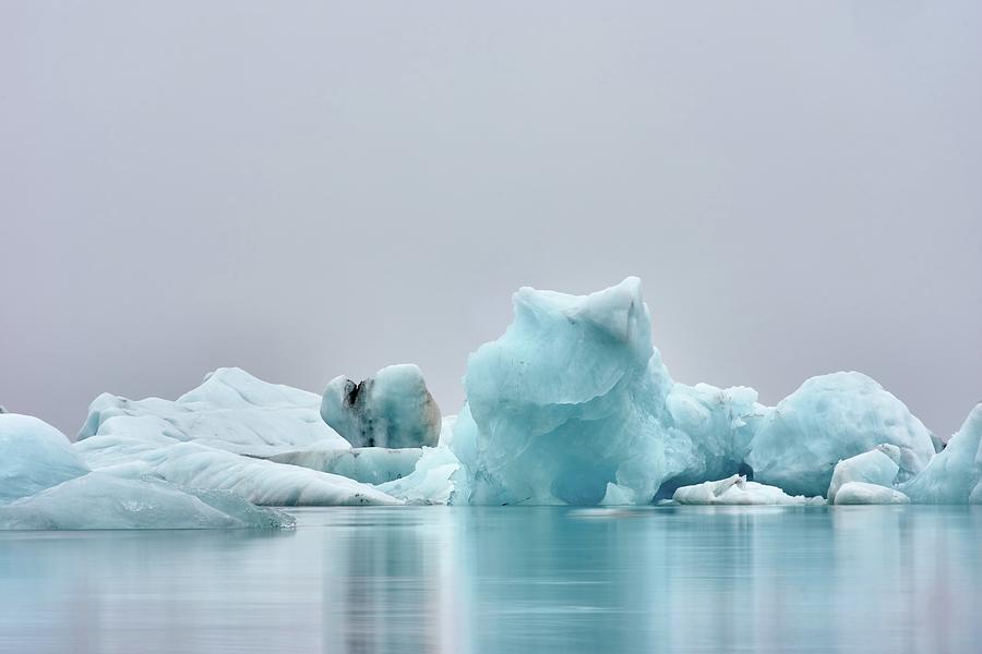 a shot I like a lot from a very miserable rainy day - ice figure near body of water - Unnamed Road, Iceland Photograph