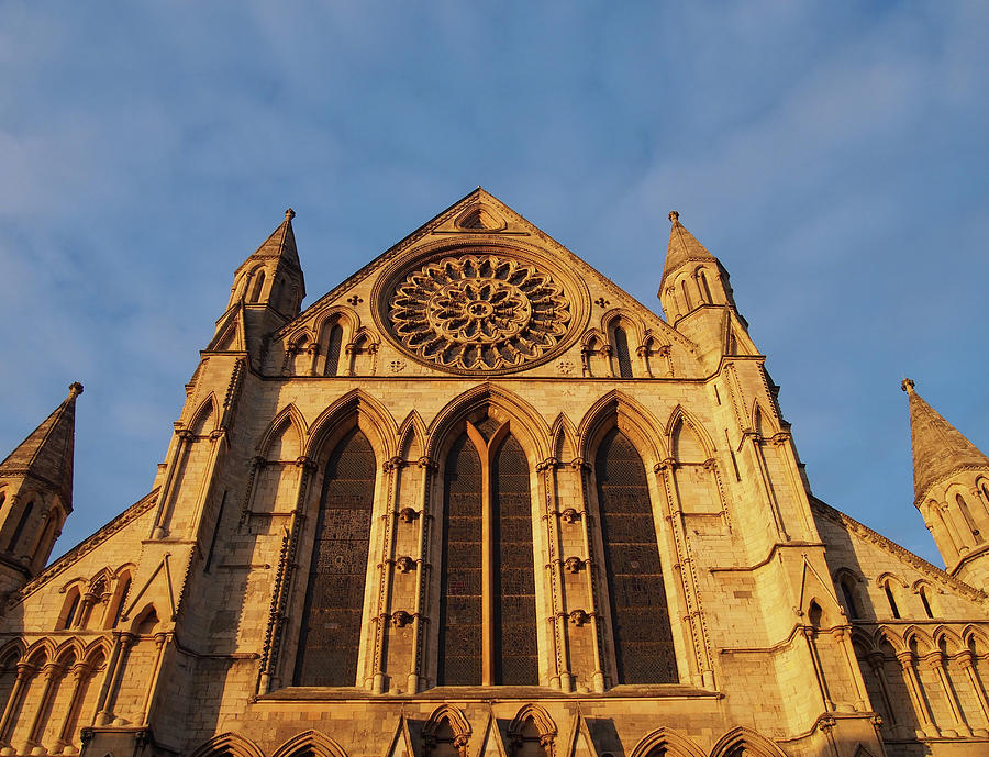 Architecture Photograph - A Side View Of York Minster In Sunlight Against A Blue Cloudy Sky by Philip Openshaw