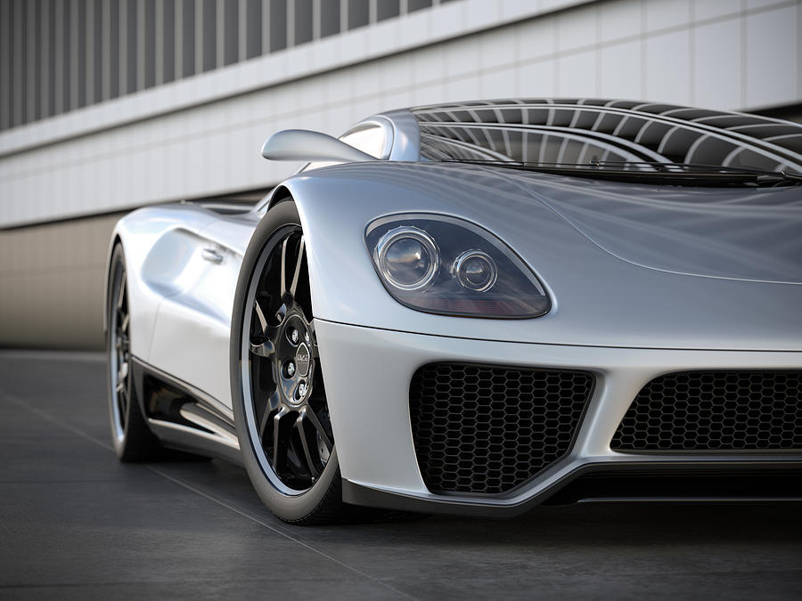 A silver sports car on black tile floor Photograph by Mevans