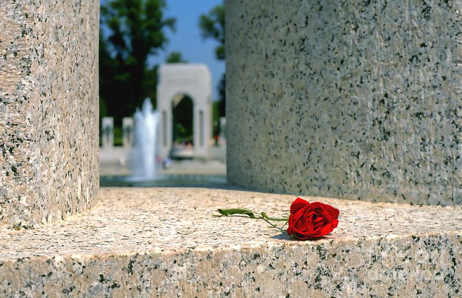 Rose Photograph - A single rose rests on a state pillar at the World War II Memorial in Washington DC by William Kuta